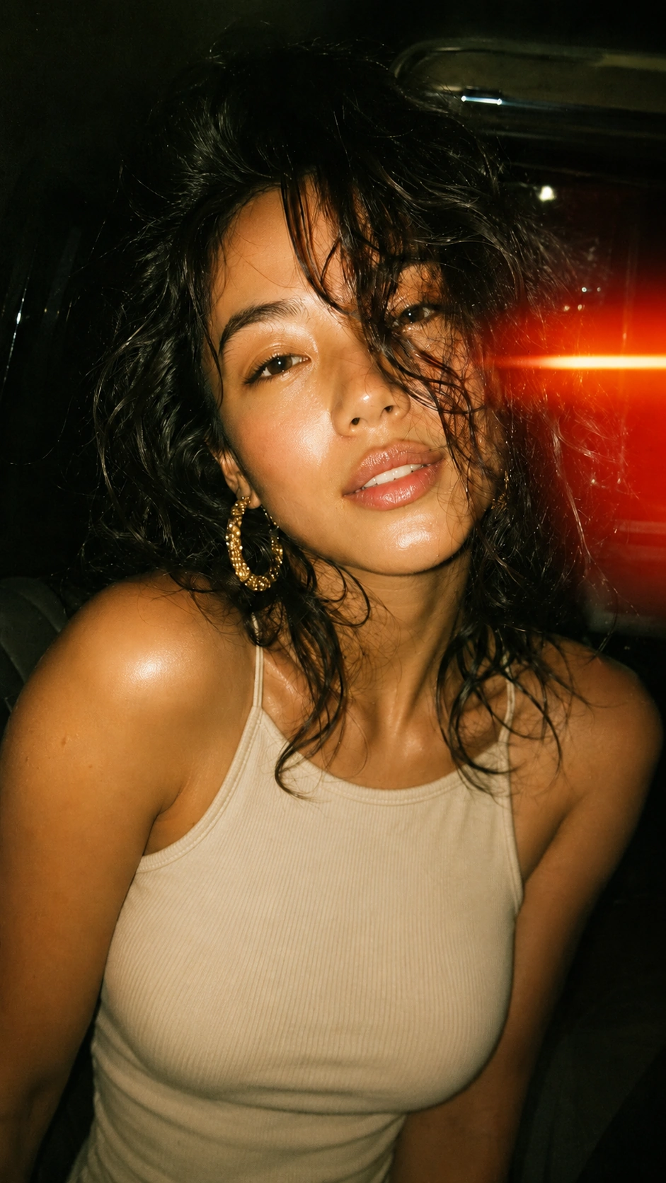Close-up AI fashion portrait of a woman lit by warm red car light